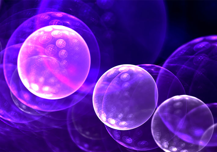 Translucent purple spheres with glowing bubble patterns illustrating cell to cell communication processes