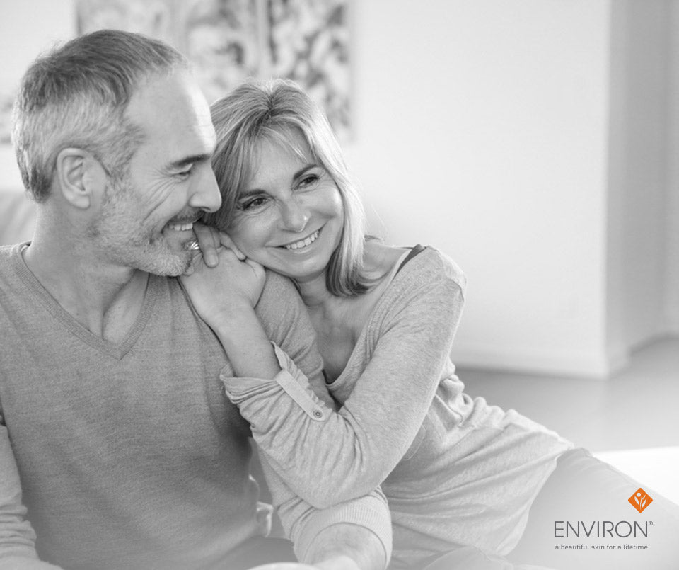 Black-and-white photograph of a smiling couple embracing illustrating ageless beauty starting with vitamins