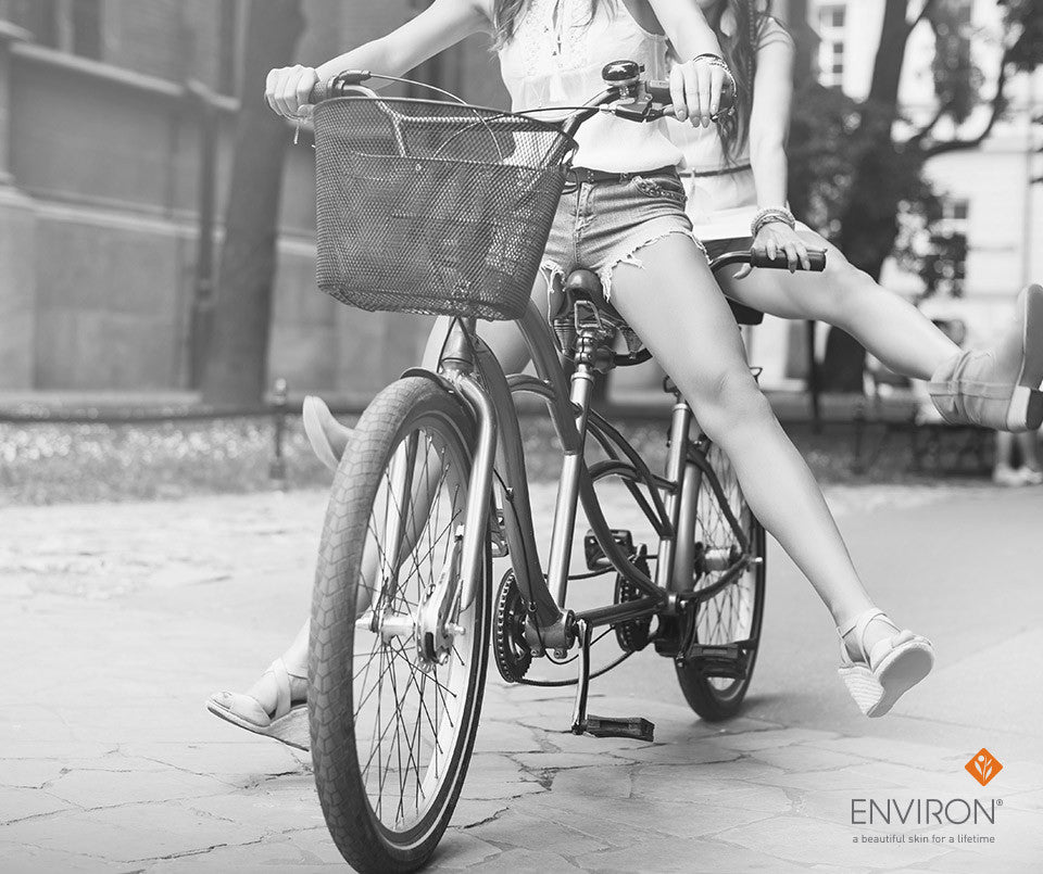 Black metal bicycle with wire mesh basket featured in an article about natural ways to look and feel younger