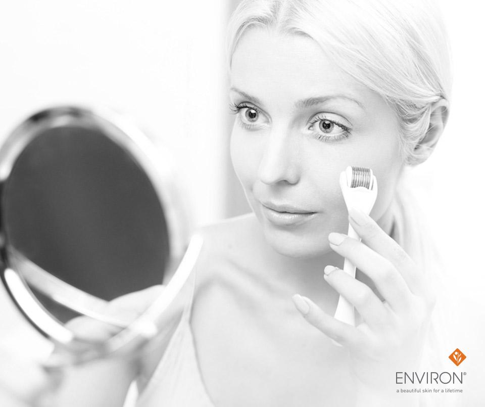 White electric derma roller with cylindrical head and fine evenly spaced needles for micro-needling therapy