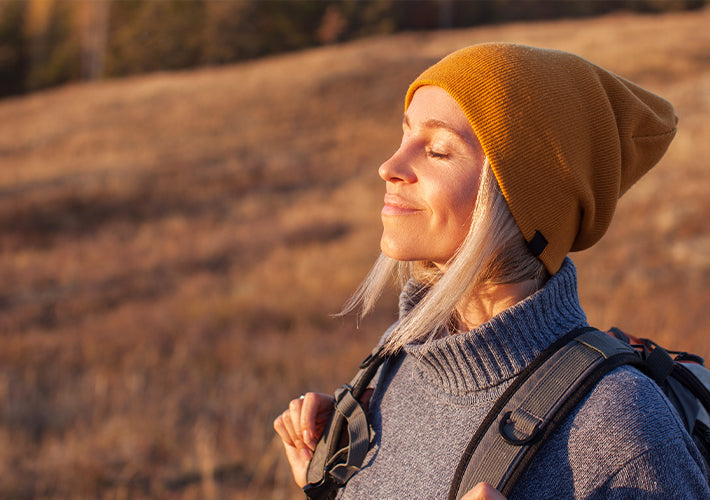 A mustard-yellow knitted beanie with a soft slouchy fit featured in an article about the science behind environ