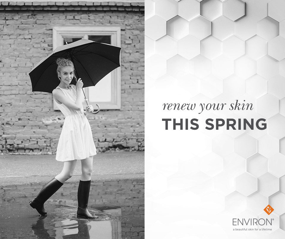A woman in a white dress and black boots holding a black umbrella with a curved handle for spring renewal