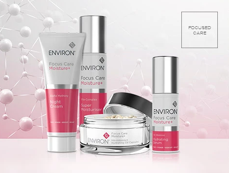 A collection of environ skincare products with sleek silver and pink glass jars and tubes for moisturizing and hydrating