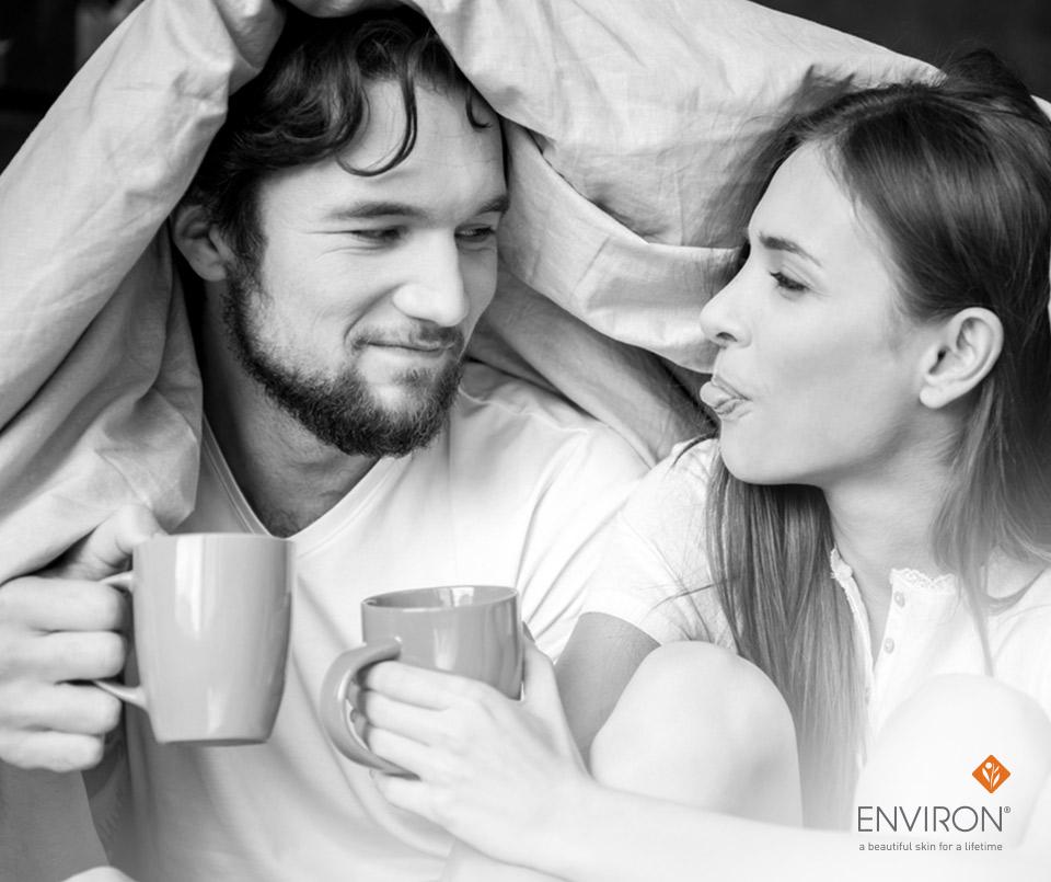 Two people holding ceramic mugs under a blanket illustrating cozy ways to boost your metabolism
