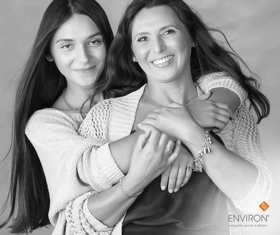 Silver chain bracelet with small dangling charms worn on a woman’s wrist in an article about avance dfp 312 skincare