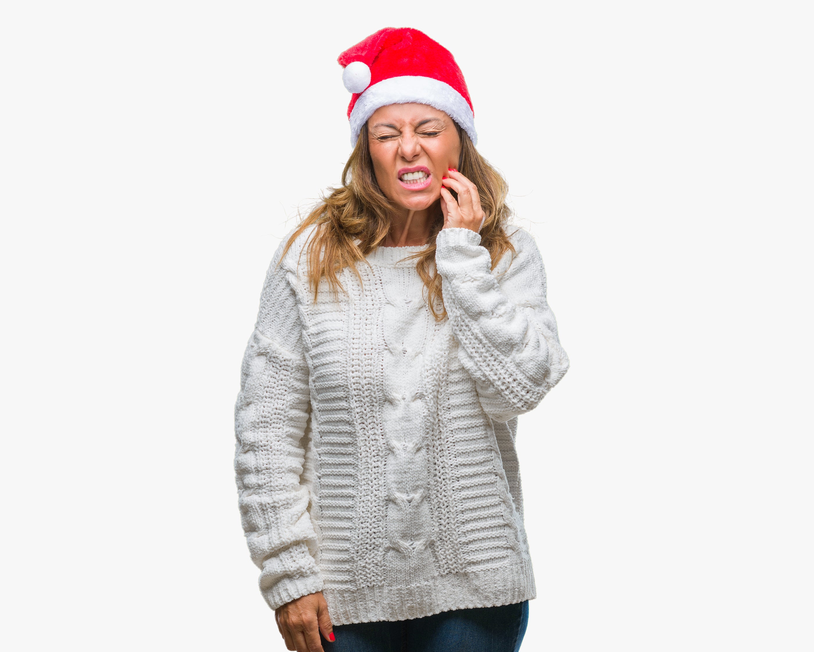 Woman wearing red and white santa hat with textured gray cable knit sweater in holiday rosacea skin care guide article