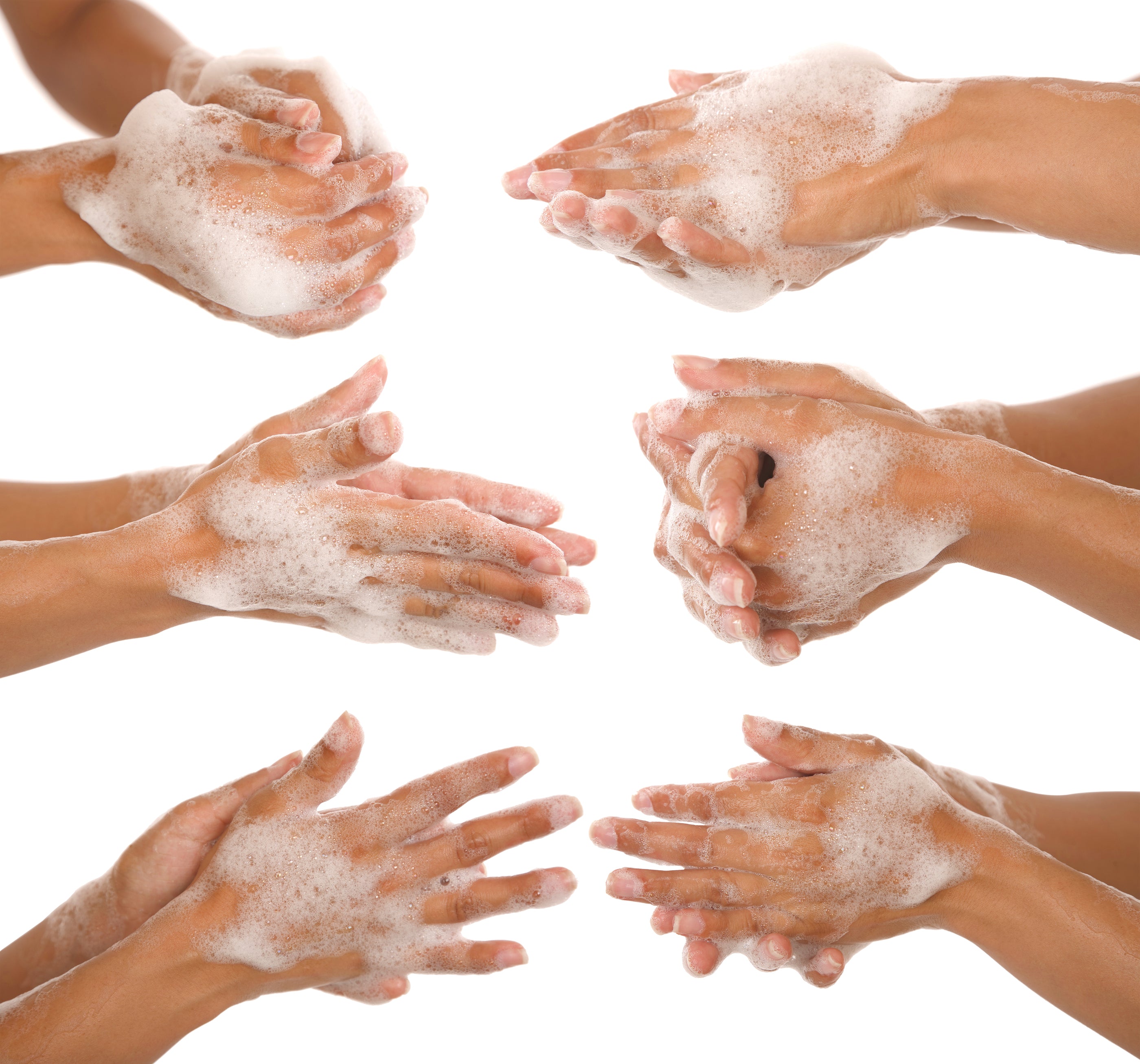 Hands covered in white soap suds demonstrating effective hand washing for good skin care and hygiene.