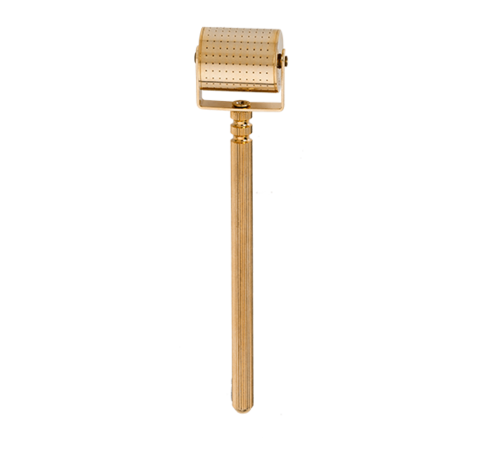 Gold-colored derma roller with cylindrical head of micro-needles and slender handle to enhance your skin care regimen.