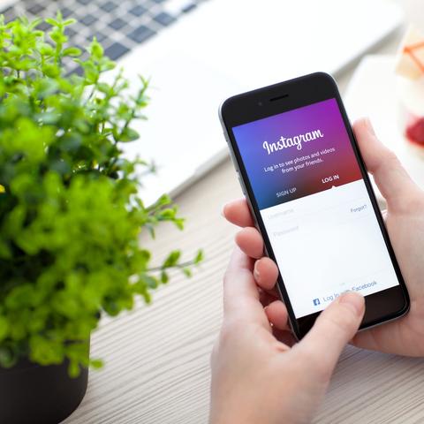 Black smartphone displaying the instagram login screen in an article titled is your business on social media