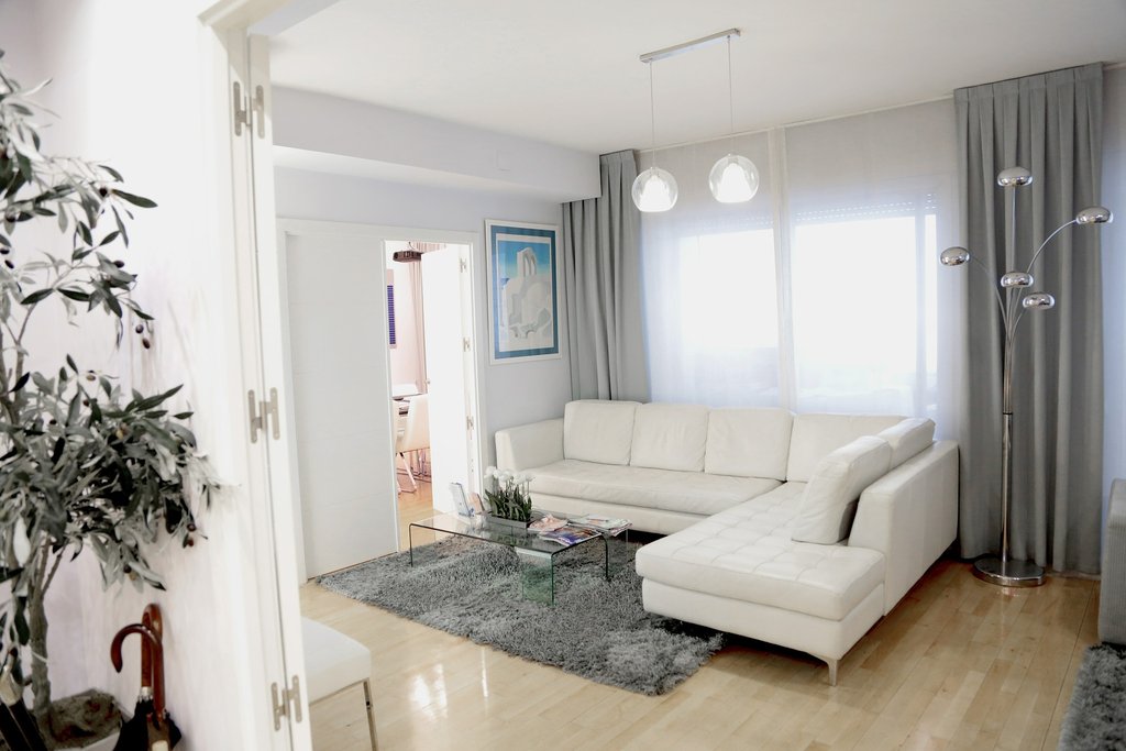 White leather sectional sofa with clean lines and modern design ideal for stylish waiting areas in skin care practices