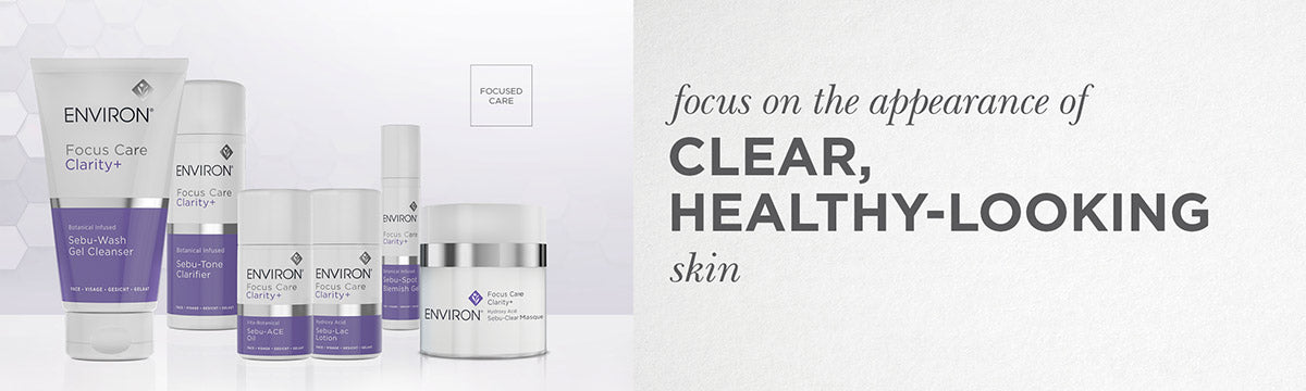 The environ focus care clarity plus skincare line features sleek white and purple tubes with silver caps for modern use