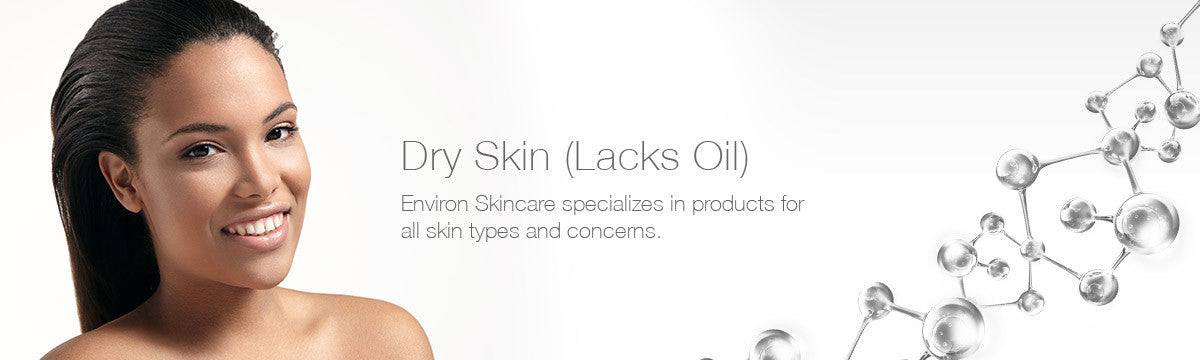 A woman with dark hair and a warm smile in a dry skin collection labeled lacks oil