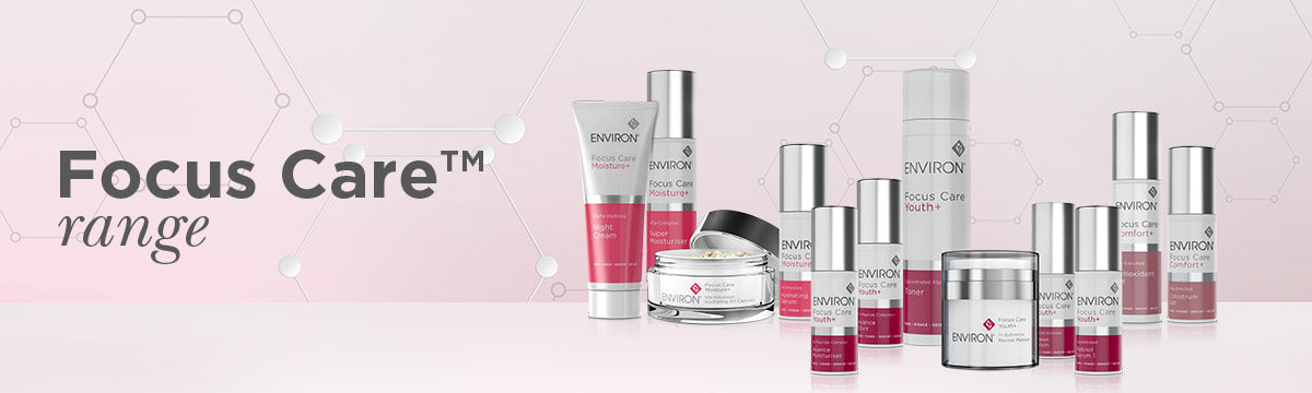 The focus care range by environ includes sleek glass and metallic skincare tubes with elegant pink accents in the focus care collection