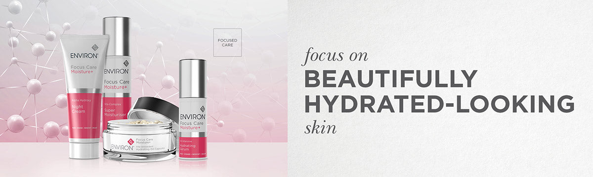 Set of environ Focus Care Moisture+ facial care products in silver and pink glass jars and metallic tubes.