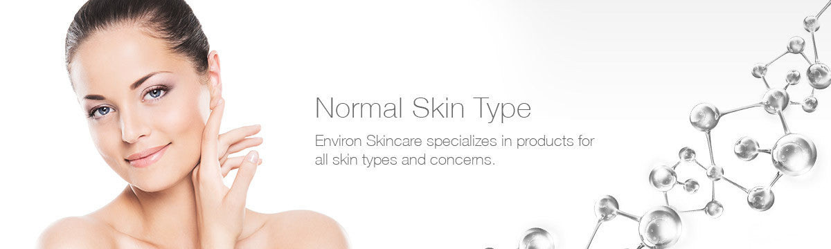 A woman with smooth clear skin gently touches her cheek in environ skincare normal skin promotional image