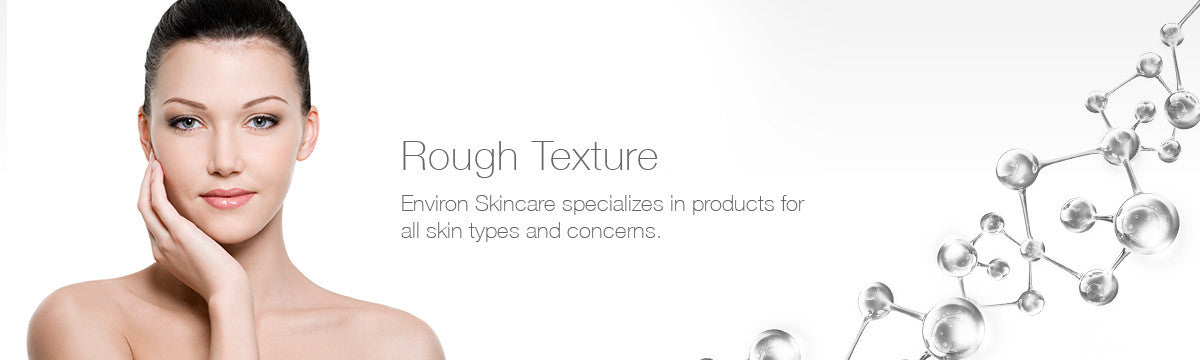 A woman with dark hair and soft natural makeup gently touches her cheek in an elegant pose from rough texture collection