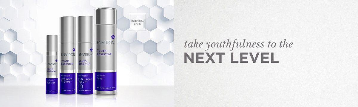 Silver and purple cylindical skincare bottles from environ youth essentiA collection featuring sleek design