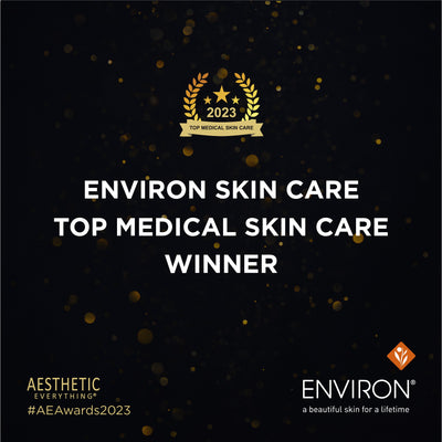 Environ skin care’s 2023 top medical skin care winner award emblem, featuring gold laurels and stars on a black background with golden bokeh.