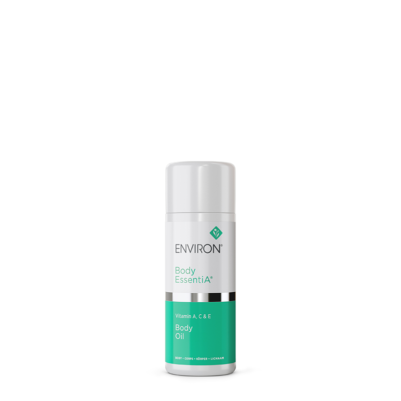 A bottle of Environ Body EssentiA Body Oil with Vitamins A, C, and E stands centered in its white and teal packaging.