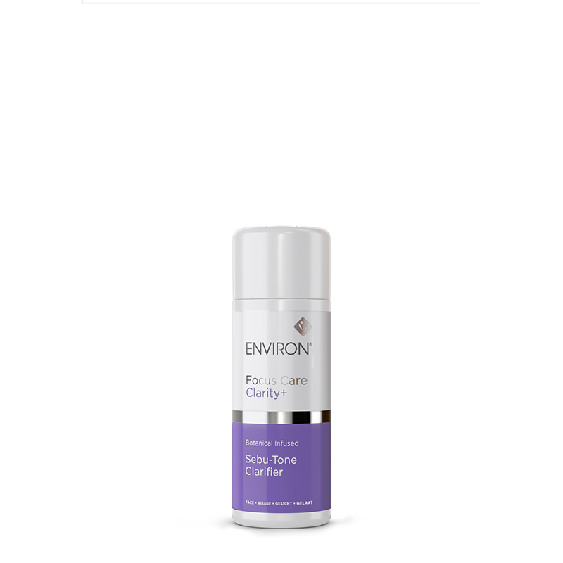 A bottle of Environ Focus Care Clarity+ Sebu-Tone Clarifier stands centered against a white background, highlighting its botanical-infused skincare formula.