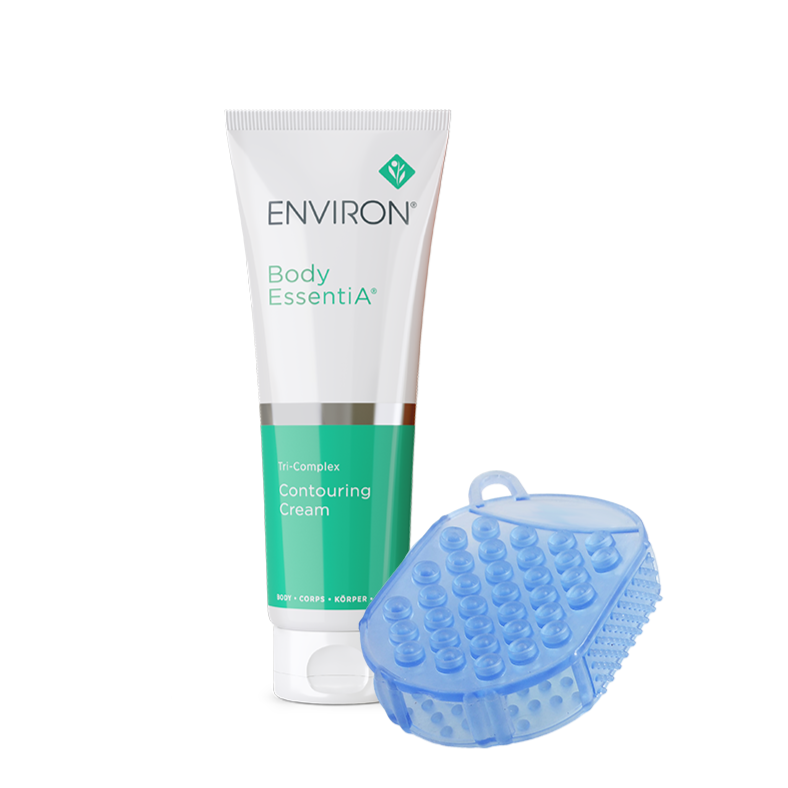 A tube of Environ Body EssentiA Tri-Complex Contouring Cream stands next to a blue textured body massager tool.