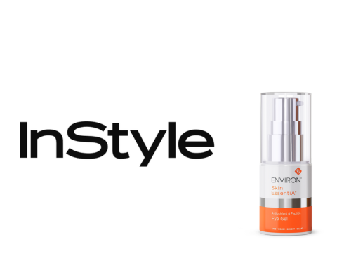 Silver and orange environ skin essentials serum bottle with a clear pump dispenser