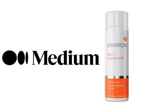 A sleek white and orange spray bottle of environ skin essentia moisturising toner.