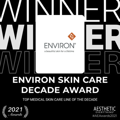 Environ skin care’s award-winning logo, featuring an orange diamond-shaped emblem with a stylized plant and the brand name in sleek black lettering.