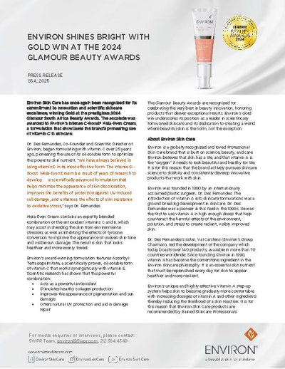 The sleek, transparent glass bottle of environ’s intense c-boost™ wide-eye cream features a gold cap and contains a light pinkish cream inside.