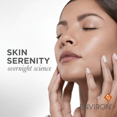 A woman with smooth, glowing skin gently cradling her face in a serene pose.