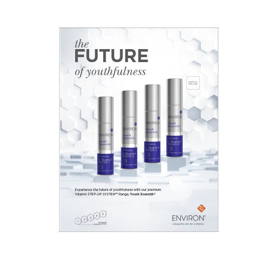 Four silver and purple bottles of Environ Youth EssentiA C-Quence Serum showcase the brand's Vitamin STEP-UP SYSTEM for anti-aging skincare.