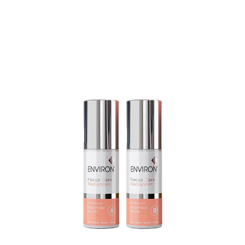Two bottles of Environ Focus Care Radiance+ Vita-Botanical Mela-Fade Serum, labeled A and B, stand side-by-side against a white background.