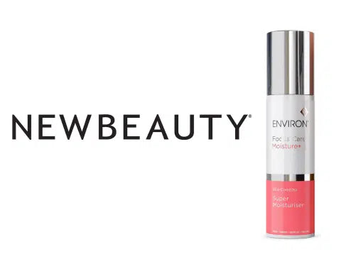A sleek silver and coral pink spray bottle of environ newbeauty face &amp; care super moisturiser.