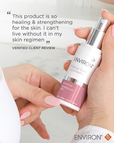 A sleek white and pink environ focus care comfort gel bottle with a silver pump dispenser.