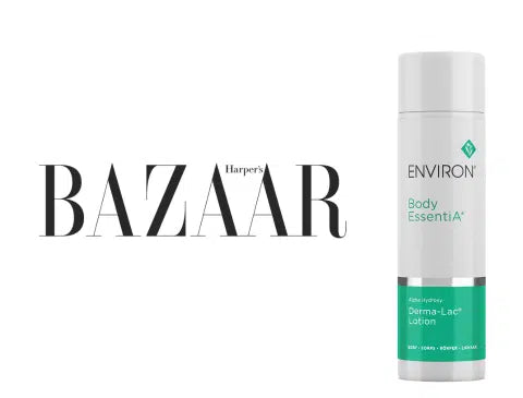 White cylindrical bottle of environ body essentia lotion with a silver band and teal label