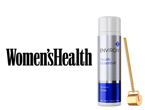 Silver and blue cylindrical bottle of environ youth essential toner with a gold-toned roller applicator beside it