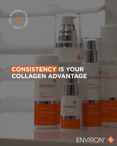 White and orange environ skin essentials skincare bottles with silver pump tops.