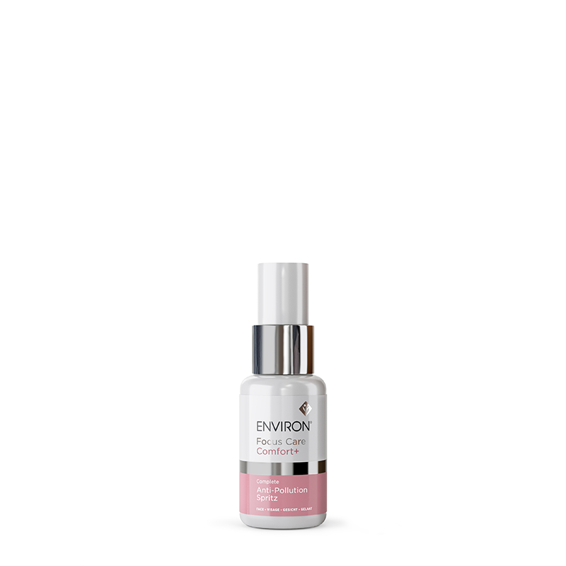A bottle of Environ Focus Care Comfort+ Complete Anti-Pollution Spritz facial mist stands against a plain white background.