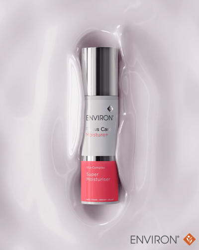 Silver and coral-colored environ super moisturiser bottle with a sleek, cylindrical design.