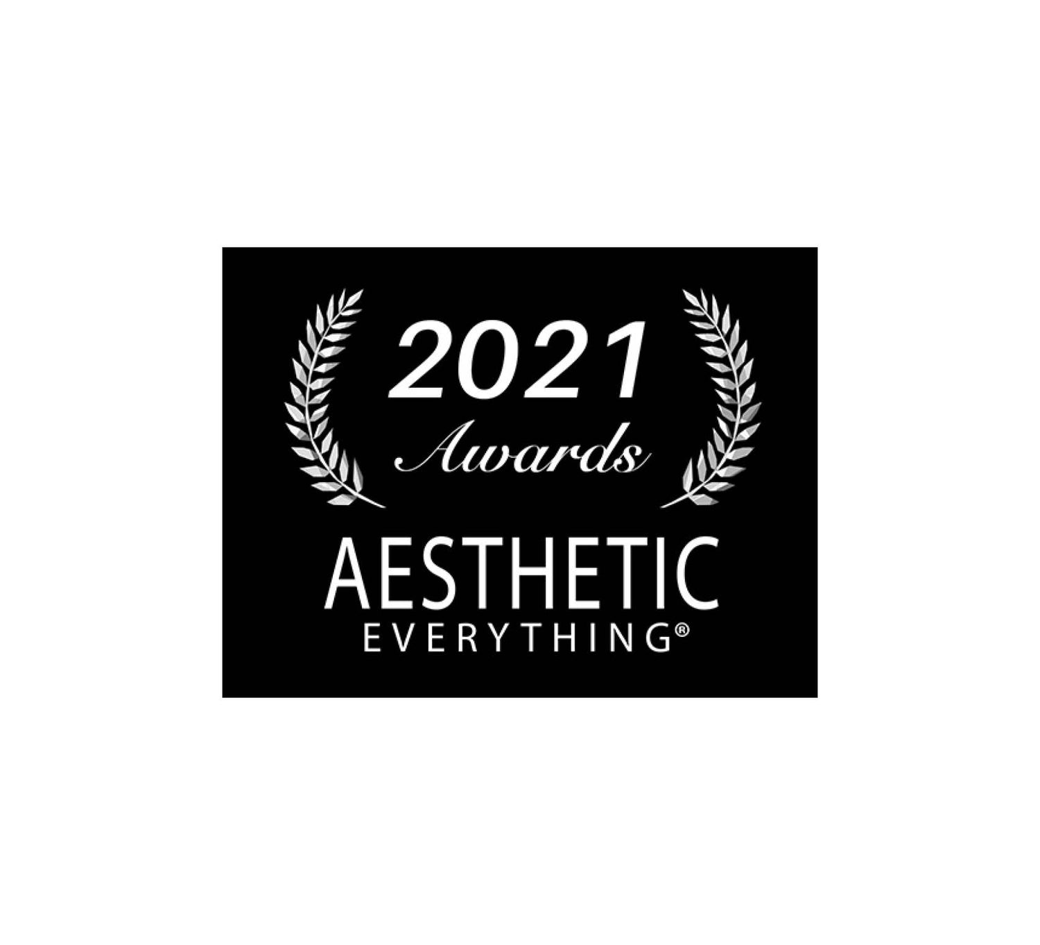 Black rectangular award plaque with white laurel wreath and text reading ’2021 awards aesthetic everything®’.
