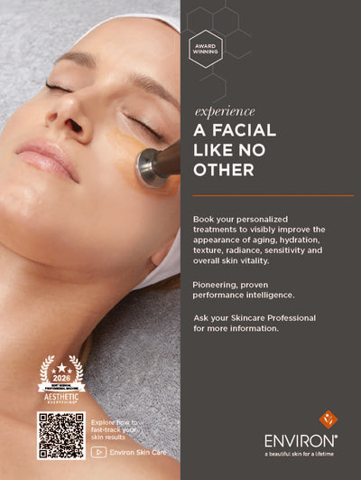 A sleek, metallic facial device with a smooth, rounded tip is being used on the skin.