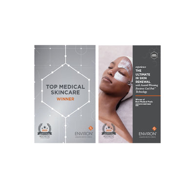 Silver and black promotional brochure for environ skincare product featuring a woman with facial mask applied