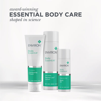White and teal environ body essentia product set featuring a contouring cream, derma-lac lotion, and body oil in sleek cylindrical containers.