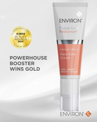 A sleek, white and coral-colored tube of environ’s focus care radiance+ intense c-bright melan-even cream.