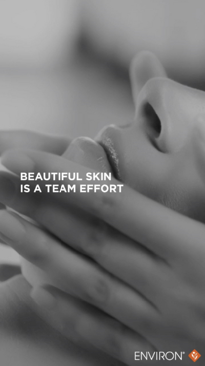 Black-and-white image of hands gently cradling a person’s face, with the text ’beautiful skin is a team effort’ and the environ logo in the corner.