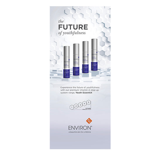 Four Environ Youth EssentiA C-Quence Serum bottles stand against a sleek hexagonal background, highlighting the brand's premium Vitamin A step-up system for anti-aging skincare.