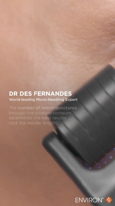 Black rectangular micro-needling device with a textured surface and blue led lights along the edge.