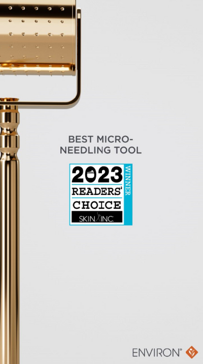 Gold-colored micro-needling roller with a sleek, polished metallic finish and evenly spaced needle heads.