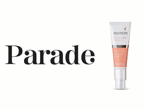 A sleek white and peach-colored environ focus care serum tube with a silver pump dispenser.