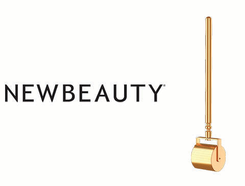 Gold-colored roller with a cylindrical handle and rounded base, featuring a sleek metallic finish.